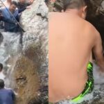 Turistas fazem parede humana para represar rio e salvar menino preso entre duas pedras